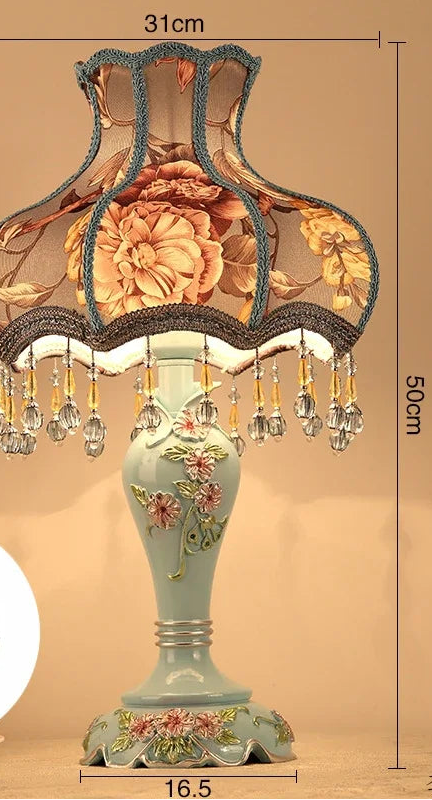 Decorative table lamp with floral design and measurements on a beige background