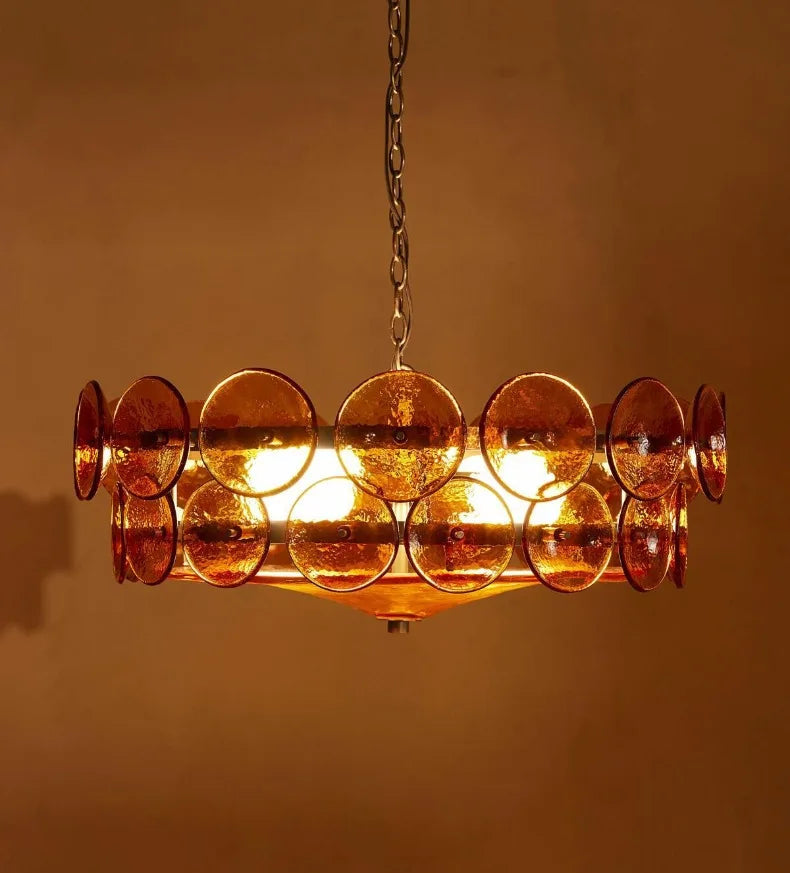 Chandelier with circular glass panels on a warm background