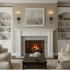 Two gold metal wall sconces with curved arms and frosted acrylic shades flank a fireplace, providing ambient light.