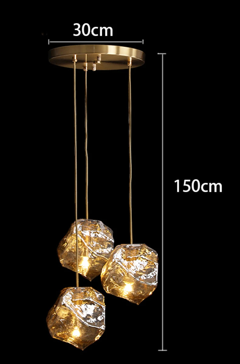 Gold pendant light with measurements on a black background