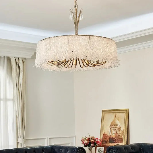 Close-up of the gold crystal waterfall chandelier showing the intricate crystal strands.
