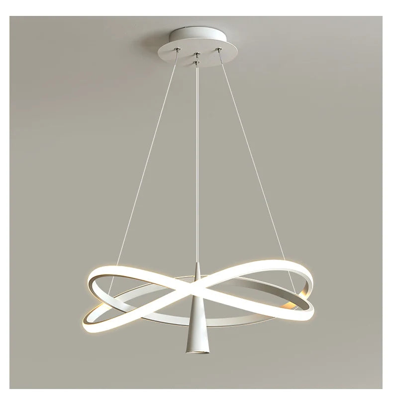 Modern pendant light with white circular design on a gray background