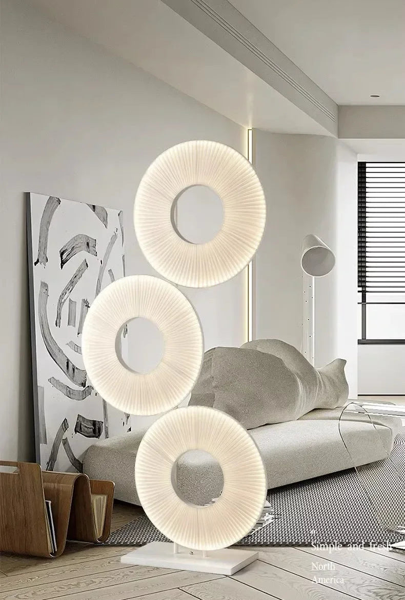 Modern interior design with a stylish lamp and abstract art in a living room.