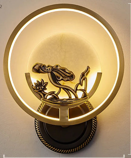 Wall-mounted light fixture with decorative design on a plain wall