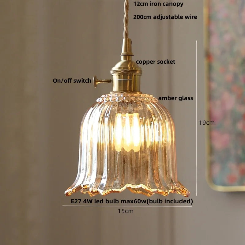 Vintage-style pendant light with clear glass shade and brass fixture, labeled with dimensions and features.