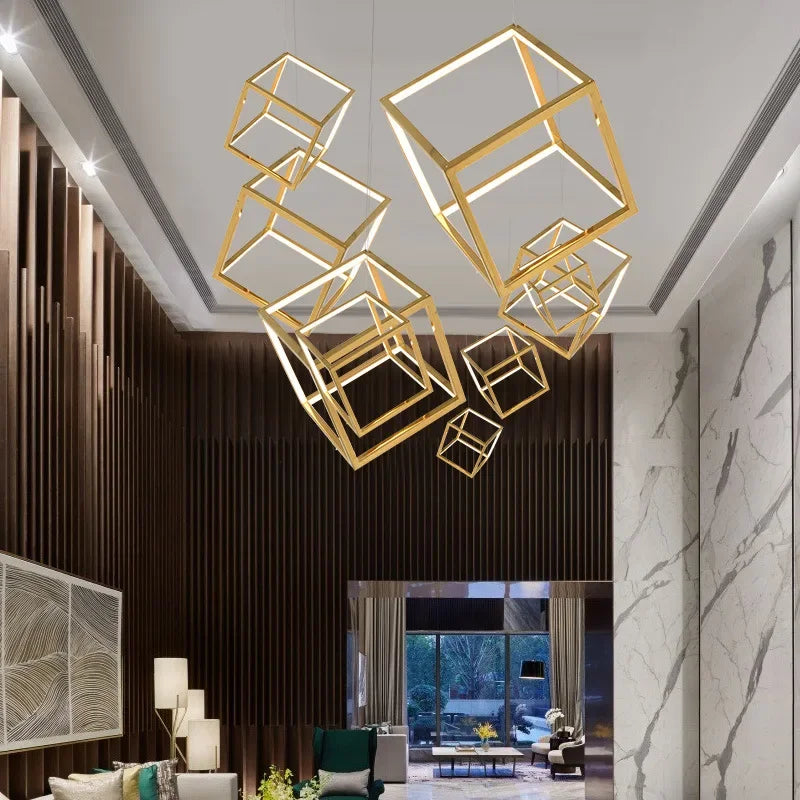 Modern interior with gold cube-shaped pendant lights in a stylish room.