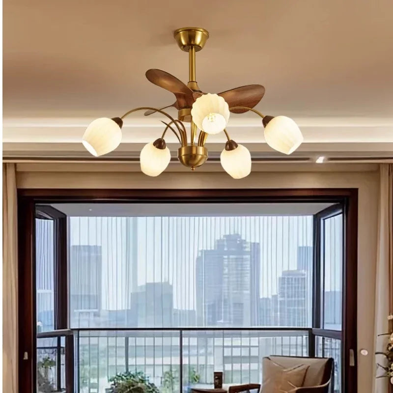 A gold sputnik starburst ceiling fan chandelier with tulip-shaped frosted glass shades and wooden fan blades, viewed from below.