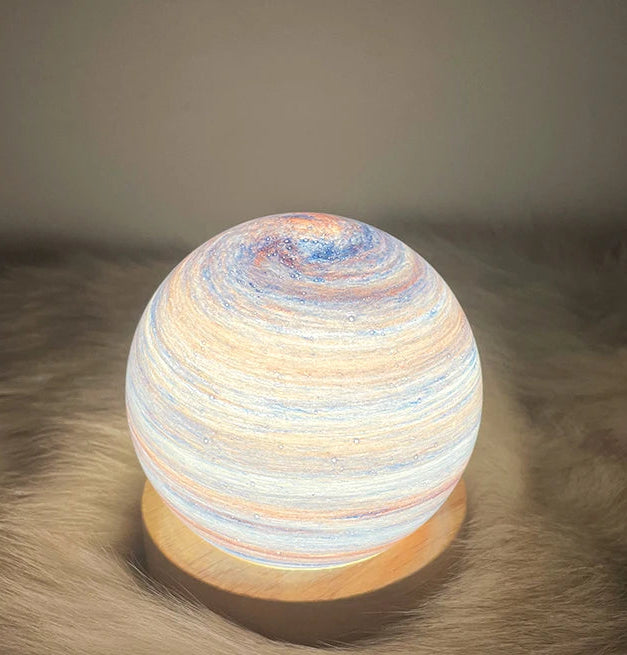 Spherical lamp with multicolored design on a textured surface