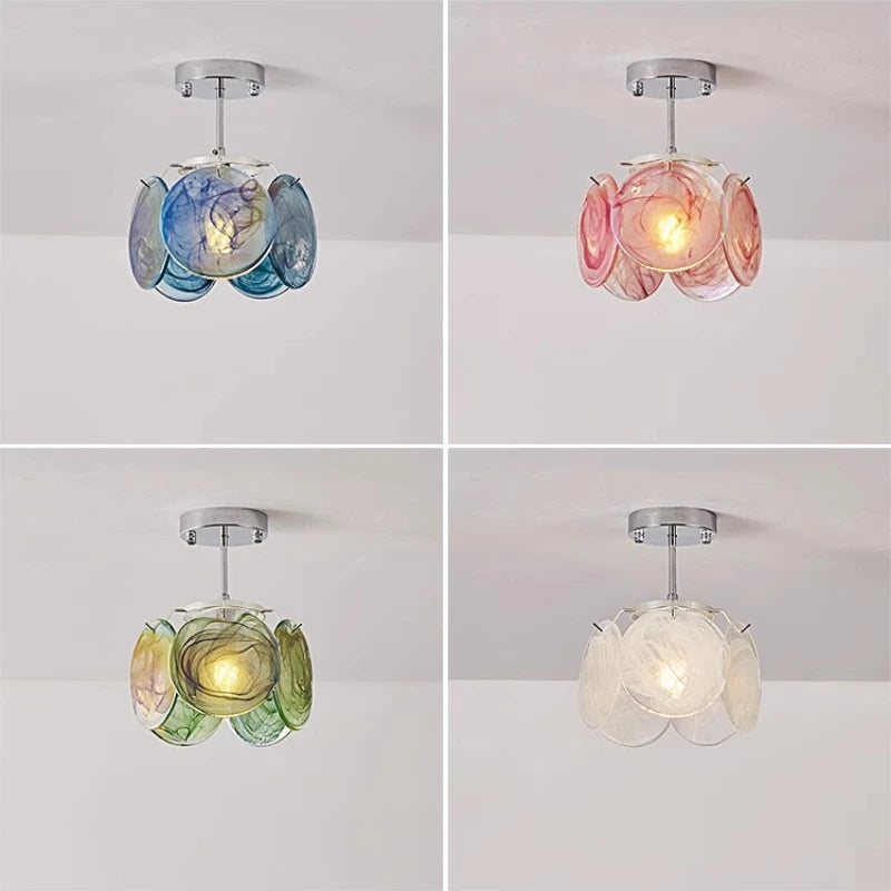 Chain-hung type floral glass pendant light in pink and white swirls, suspended by a chain.