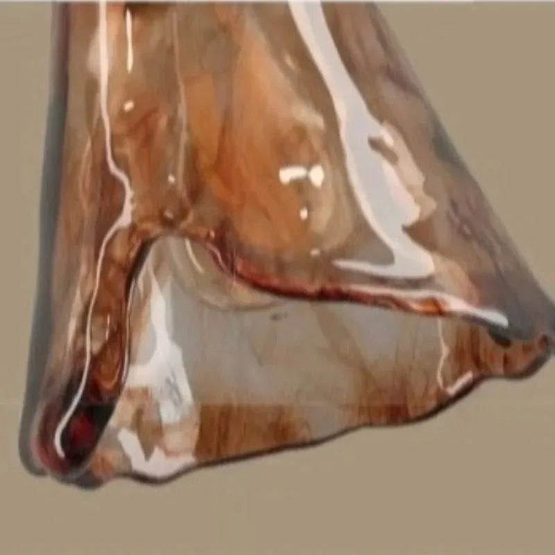 Clear plastic bag with a brownish product inside on a beige background