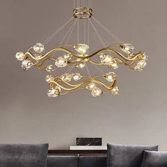 Close-up view of the gold wavy crystal chandelier, highlighting the intricate design and crystal details.