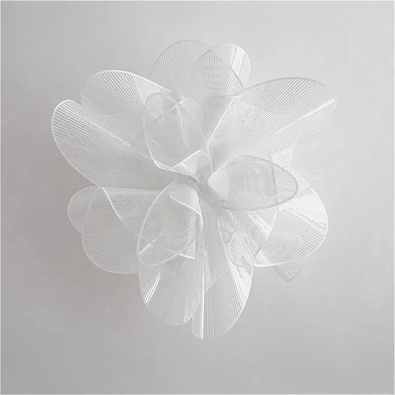 White floral decorative item on a light gray background