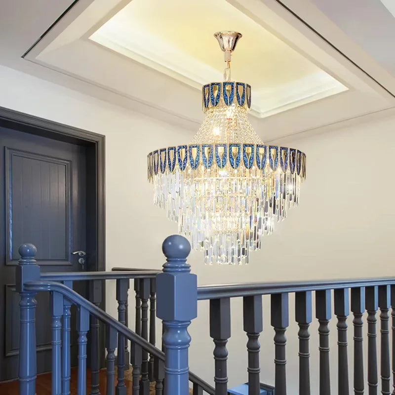 Close-up view of the gold chandelier's frame and crystal accents, highlighting the detailed craftsmanship.