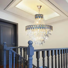 Close-up view of the gold chandelier's frame and crystal accents, highlighting the detailed craftsmanship.