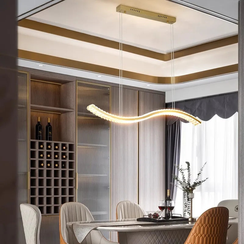 Modern dining room with a stylish chandelier, table, chairs, and wine rack.