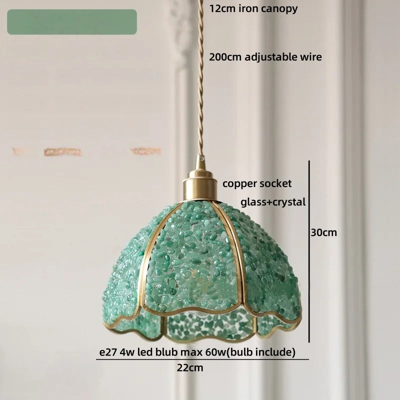 Green pendant light with measurements and details on a neutral background