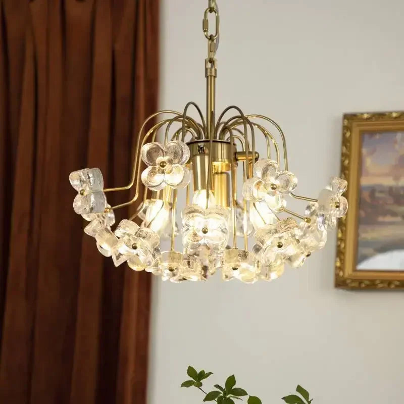 Angled view of a gold-tone floral glass pendant light with cascading elements.