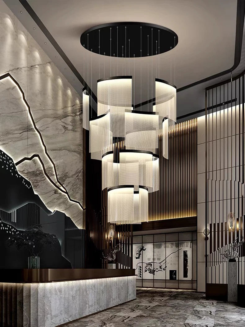 Luxurious interior design with a chandelier, marble walls, and modern decor.