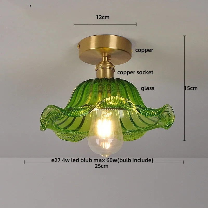 Green glass ceiling light fixture with measurements on a gray background