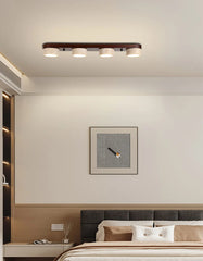Modern bedroom with ceiling light fixture and wall art