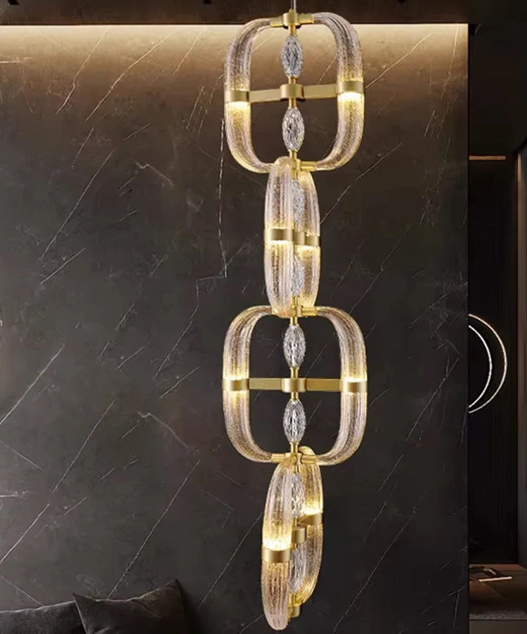 Decorative chandelier with gold and clear design on a dark background