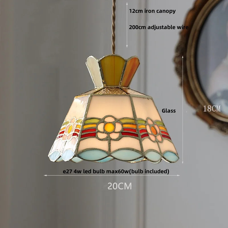 Stained glass pendant light with measurements on a gray background