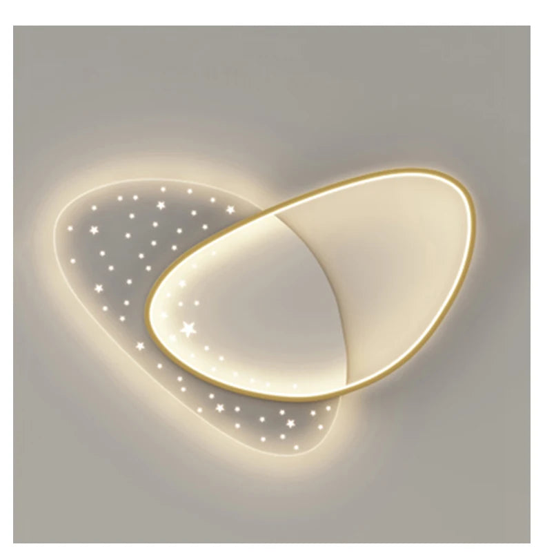 Heart-shaped wall light fixture with star details on a plain background