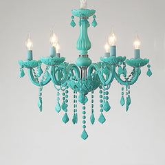 Close-up of a cyan crystal chandelier with six flame-shaped LED bulbs and intricate crystal detailing, against a white background.