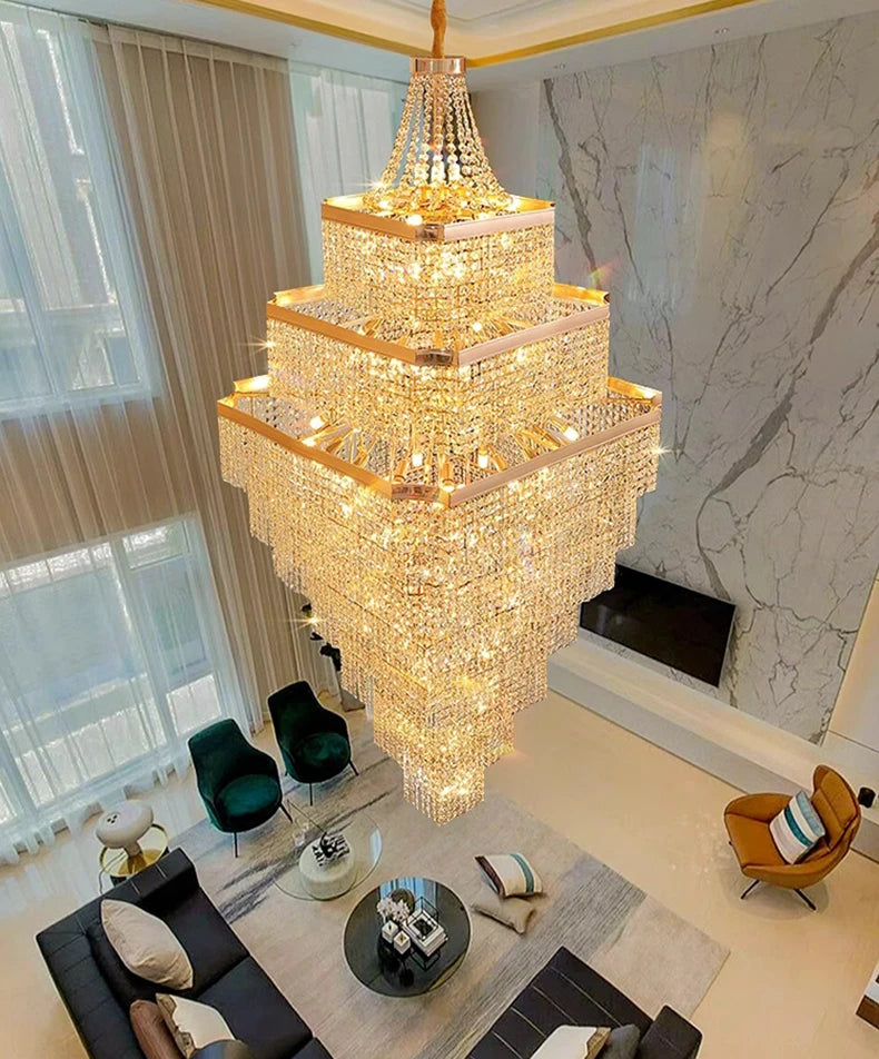 Luxurious chandelier hanging in a modern living room with marble wall and furniture.