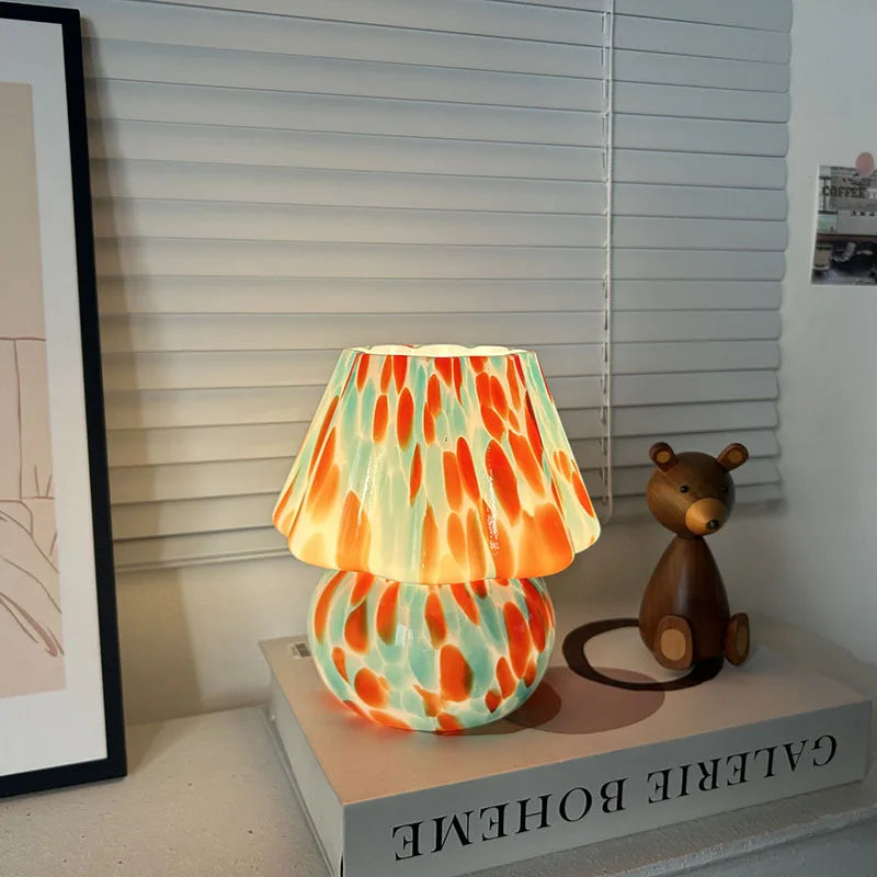 Colorful lamp with a teddy bear figurine on a shelf
