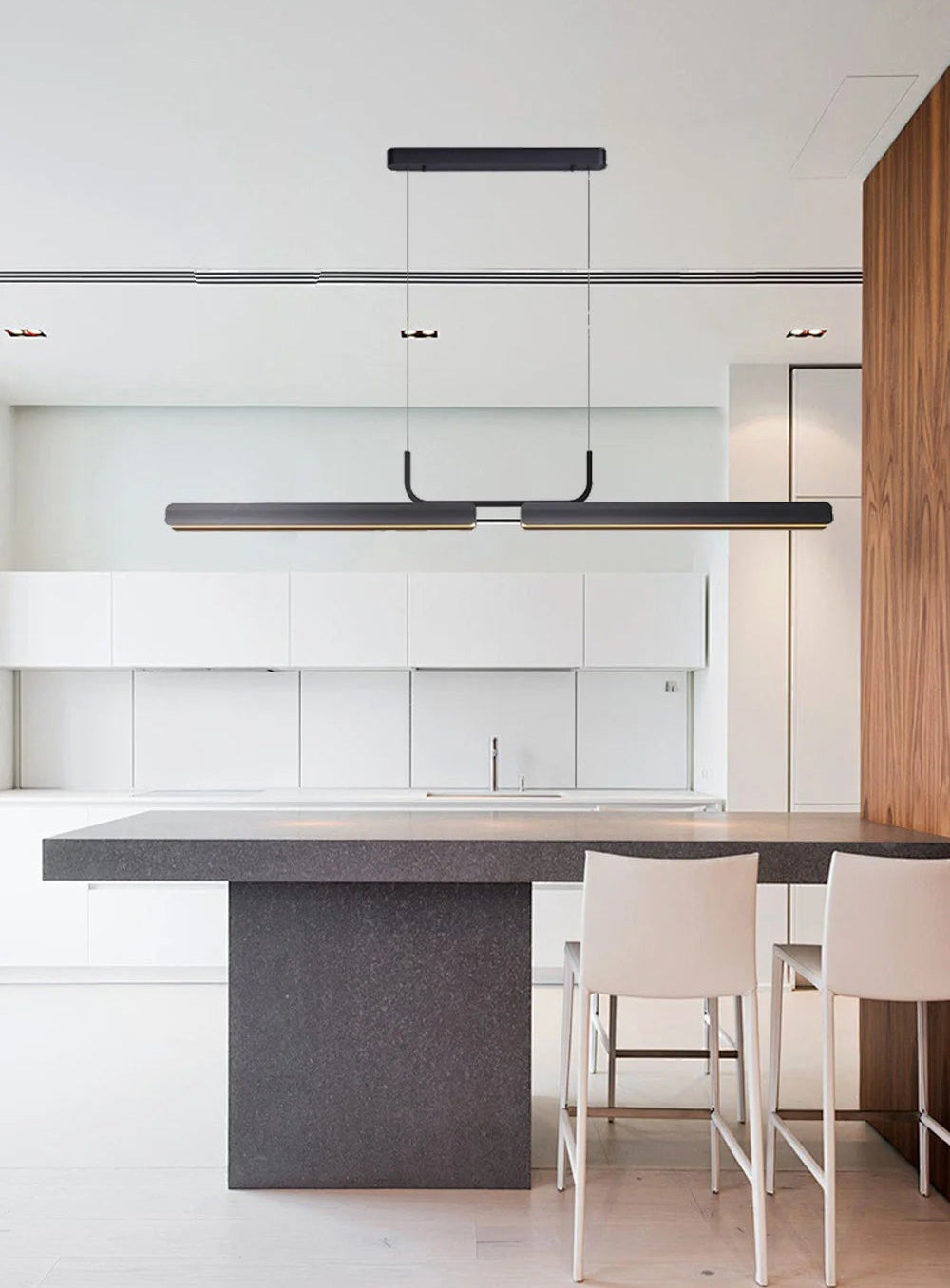 Modern kitchen with white cabinets, gray island, and white chairs.