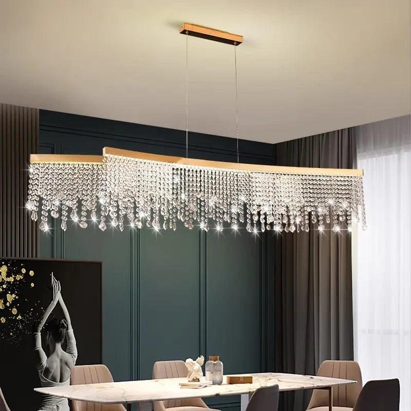 Modern chandelier hanging above a dining table in a stylish room.
