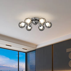 View of a polished chrome starburst chandelier from a slightly different angle, highlighting its multi-directional arms.