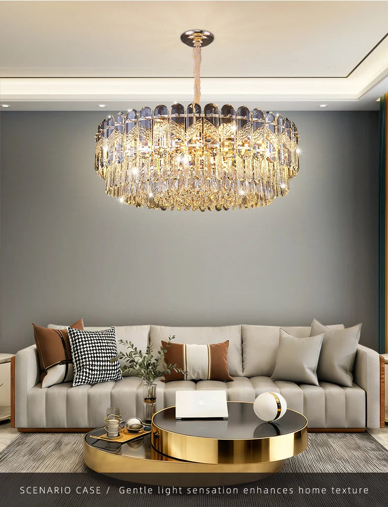 A gold crystal chandelier with a layered design, suspended above a dining table in a well-lit room.