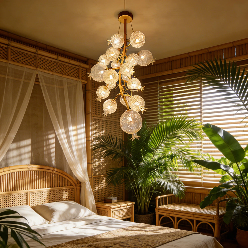 Gold floral chandelier with crystal accents in a bedroom setting.