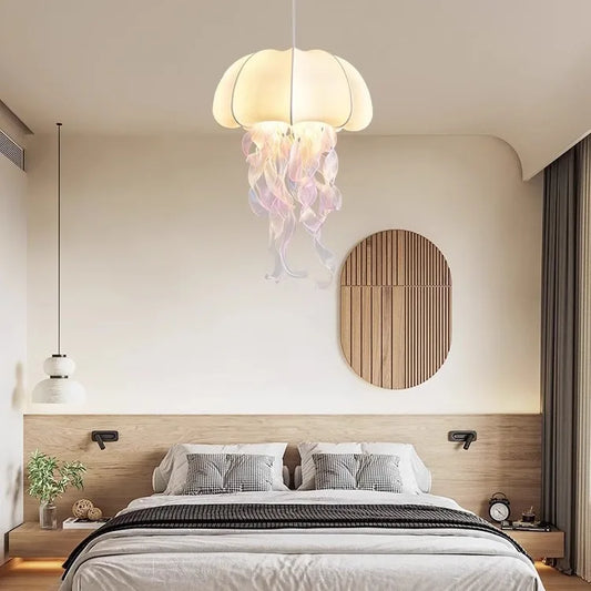 Bedroom with a jellyfish-shaped pendant light hanging above a bed