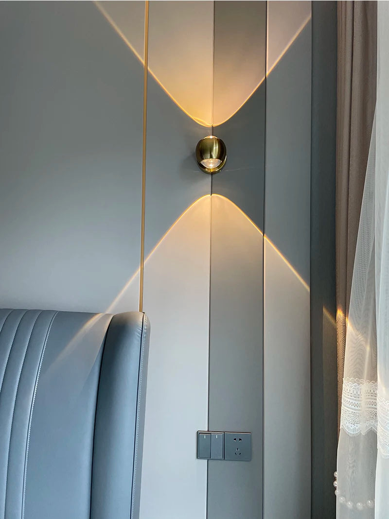 Modern interior design with a light fixture on a gray wall.