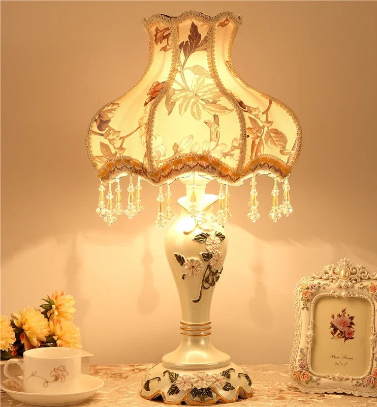 Decorative table lamp with floral design on a warm background