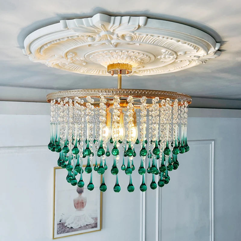Decorative ceiling light fixture with green accents in a room setting.
