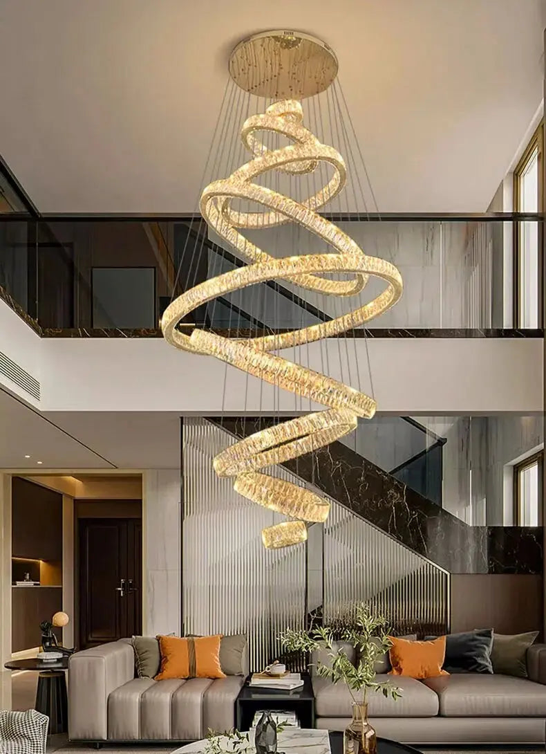 Modern chandelier hanging in a stylish living room with a sofa and decor.