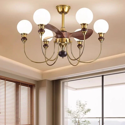 Close-up view of a gold sputnik starburst ceiling fan chandelier with wooden blades and frosted glass globe lights, showcasing its intricate design.
