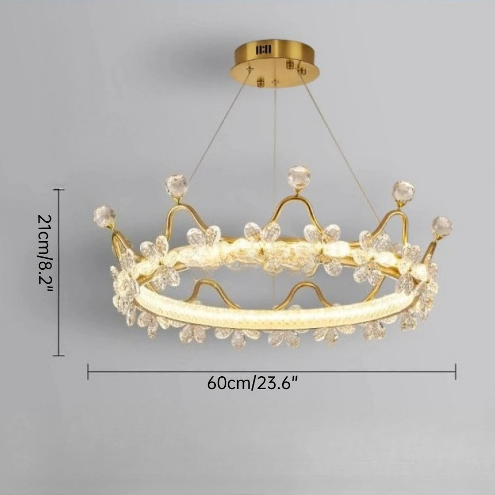 Gold chandelier with crystal accents on a gray background, showing dimensions.