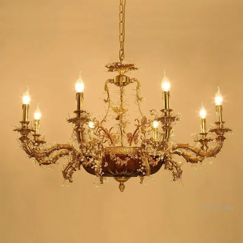 Gold chandelier with multiple lights on a beige background