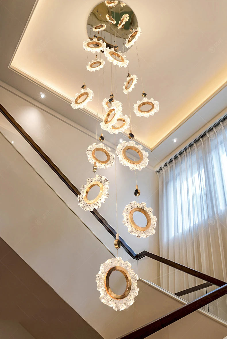 Decorative ceiling lights in a modern interior setting with a staircase.