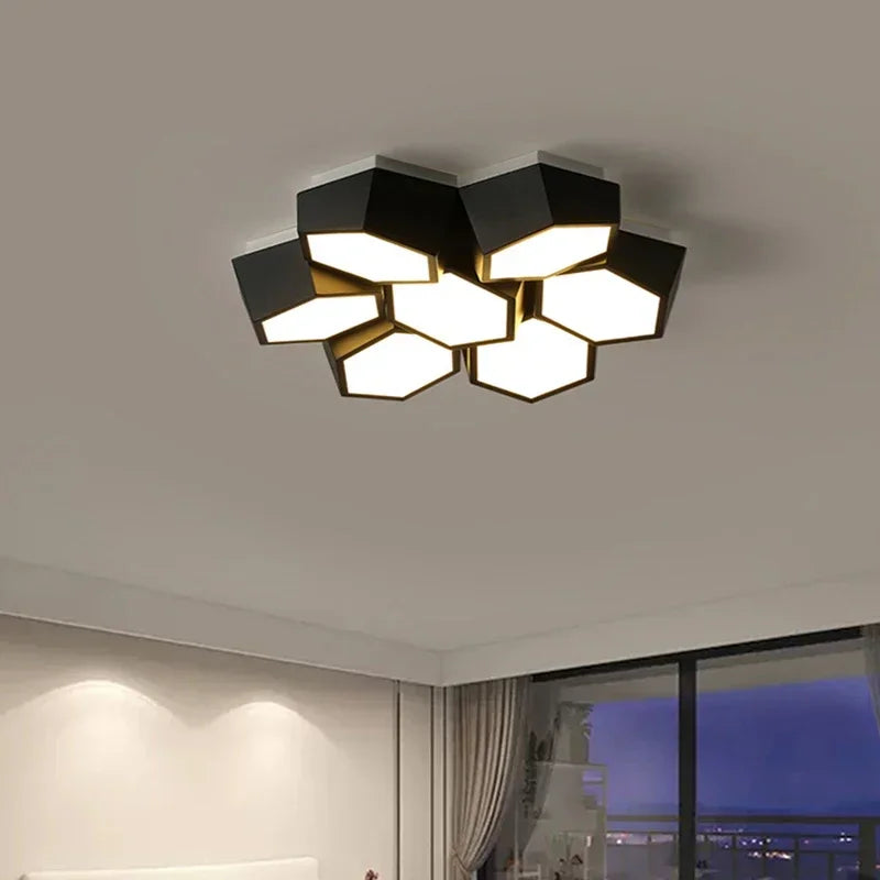 A black geometric cluster ceiling light viewed from an angle, highlighting its multi-faceted design and surface-mounted installation.