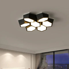 A black geometric cluster ceiling light viewed from an angle, highlighting its multi-faceted design and surface-mounted installation.
