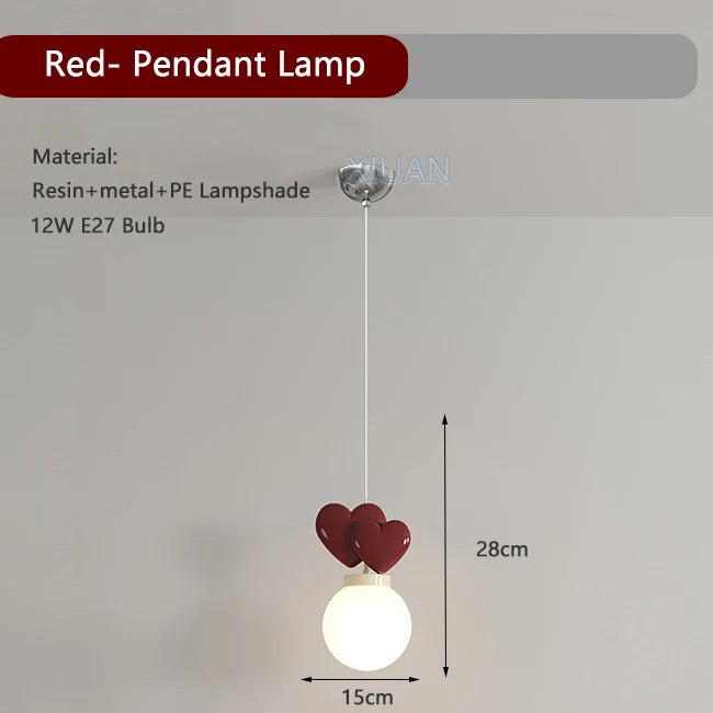 Red pendant lamp with heart-shaped design on a gray background