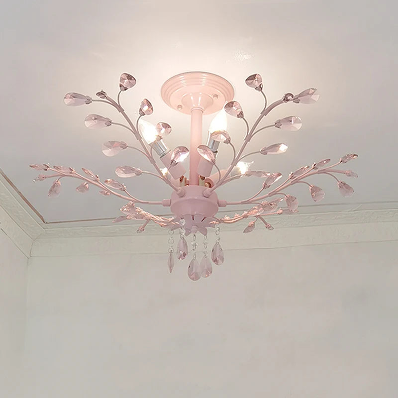 Pink floral semi-flush ceiling light with crystal accents mounted on a white ceiling.
