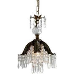 Brass crystal chandelier with a leaf-shaped canopy and cascading teardrop crystals, isolated on white background.