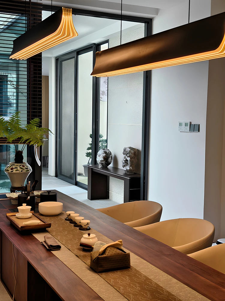 Modern interior with a wooden table, chairs, and decorative items.